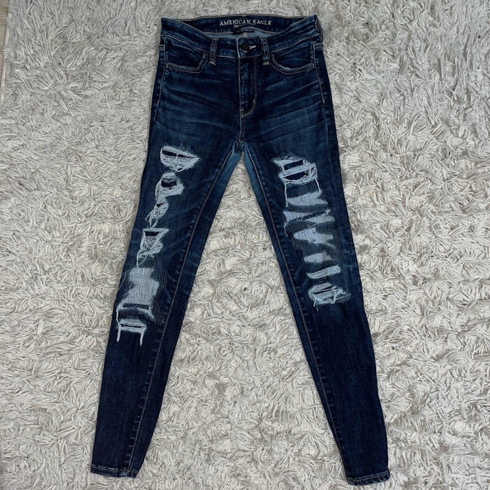American Eagle skinny ripped blue/navy jeans (never used) size 0.